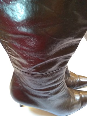 Lot 1055 - A pair of Gucci brown leather knee-high heeled boots