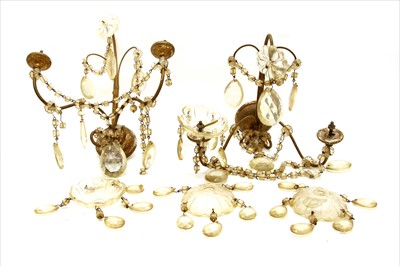 Lot 255 - A pair of gilt bronze twin branch floral wall lights