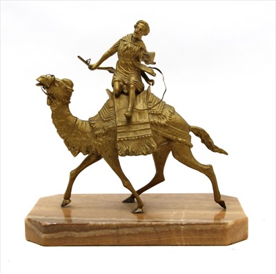 Lot 260 - A gilt metal figure of a warrior atop a camel