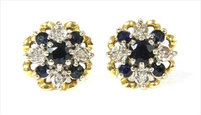 Lot 38 - A pair of 18ct gold sapphire and diamond cluster earrings