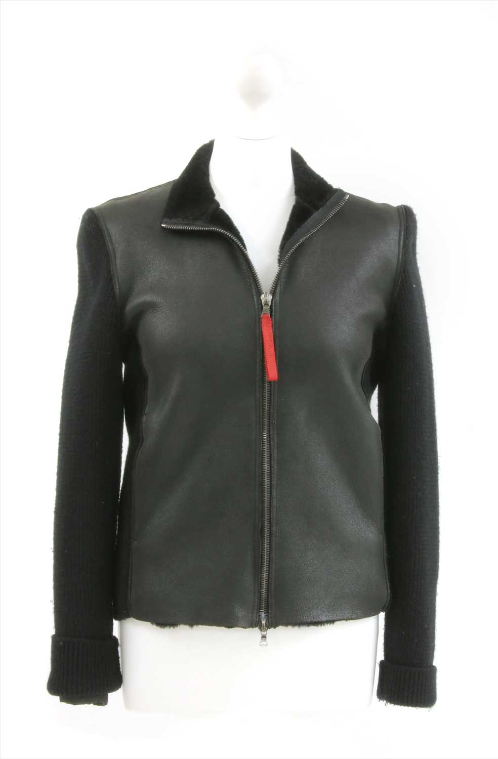 Lot 1095 - A Prada zip-up jumper with front leather panels