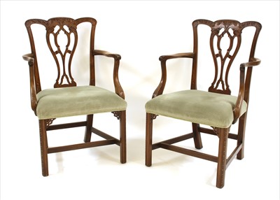 Lot 421 - A pair of George III style mahogany elbow chairs