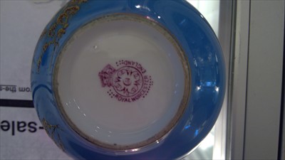 Lot 149 - A Royal Worcester powder blue cup and saucer