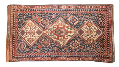 Lot 951 - A Qashqai cream ground rug