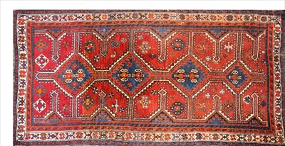 Lot 373 - An oriental red ground rug