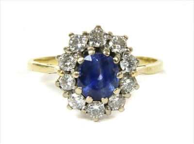 Lot 55 - A gold sapphire and diamond cluster ring