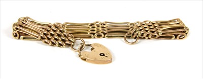 Lot 25 - A gold five row gate bracelet