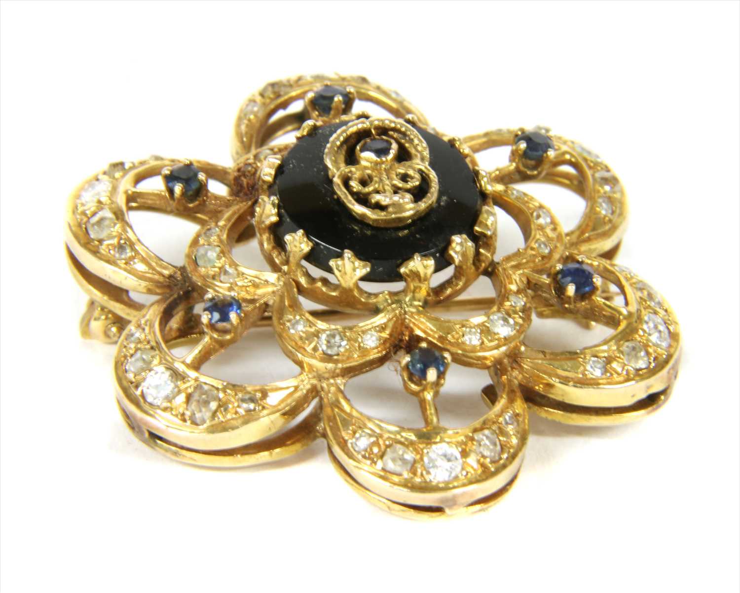 Lot 19 - A gold sapphire, onyx and diamond brooch/pendant