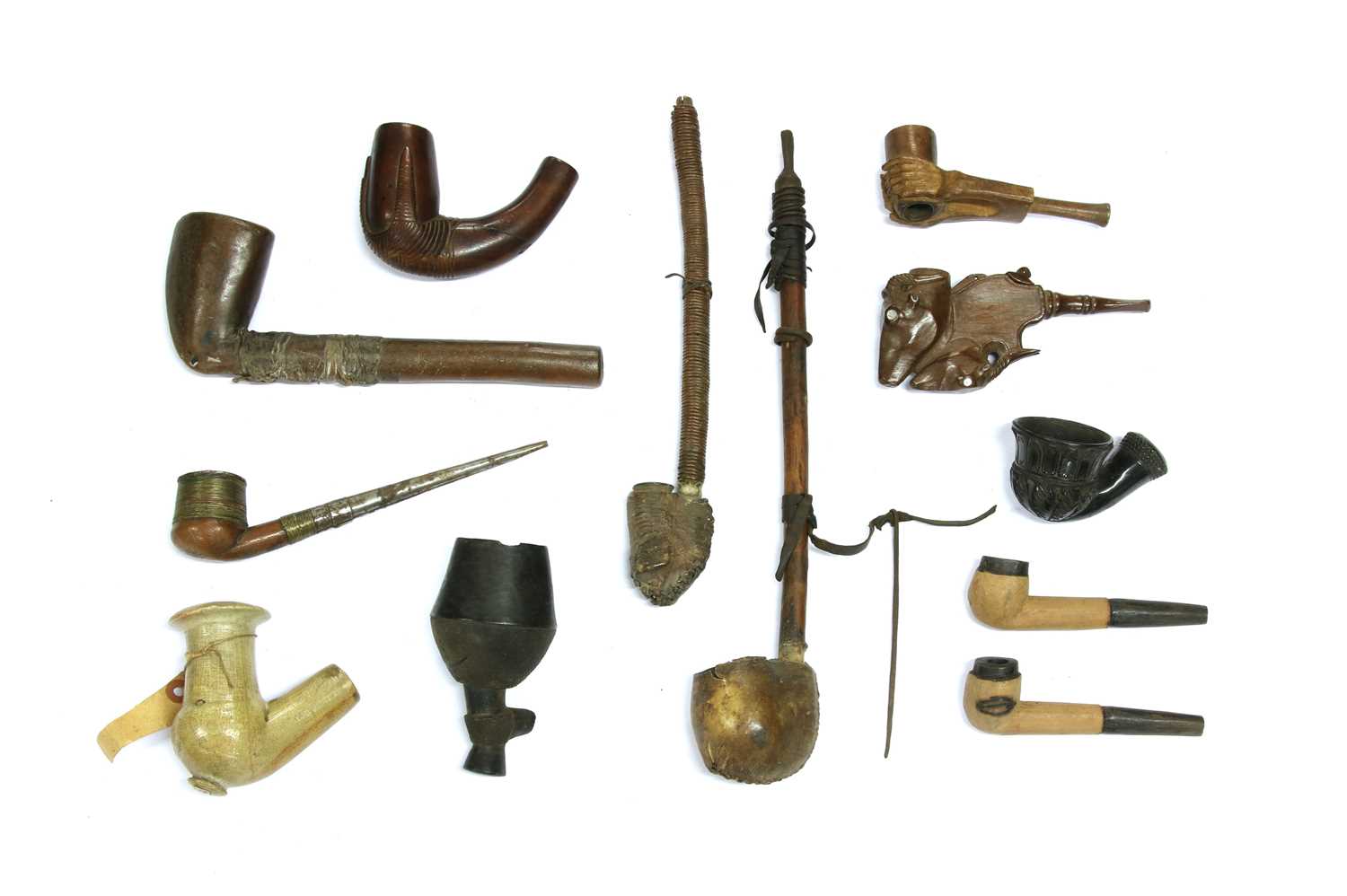 Lot 214 - A collection of twelve African pipes