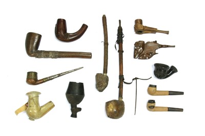 Lot 214 - A collection of twelve African pipes
