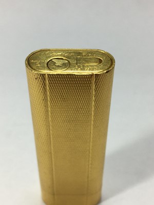 Lot 215 - A gold plated Cartier cigarette lighter