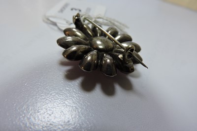 Lot 3 - A Georgian silver, pink foil-backed paste flower head brooch