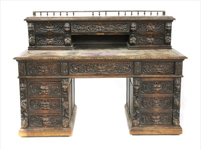 Lot 481 - A Victorian carved oak writing desk