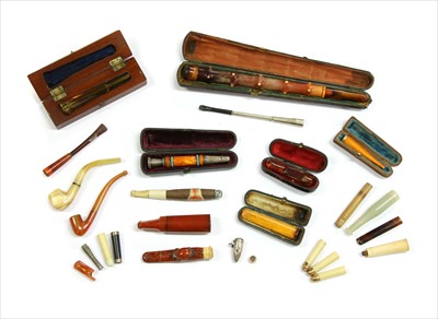 Lot 224 - A collection of cheroot holders and pipes