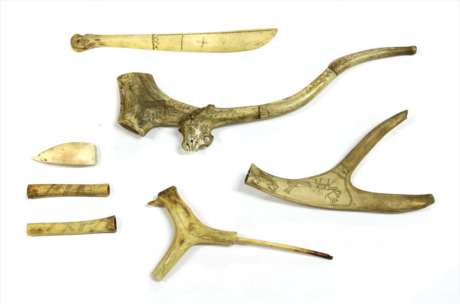 Lot 178 - A collection of Scandinavian antler pipes and objects
