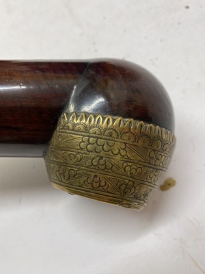 Lot 67 - A Chinese wood and brass-mounted opium pipe