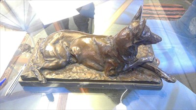 Lot 230 - A German bronze figure of a recumbent German Shepherd