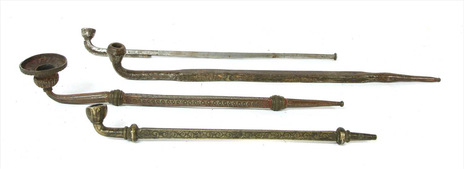 Lot 11 - Four Tibetan steel and metal pipes