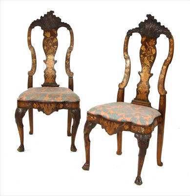 Lot 658 - A pair of Dutch walnut, satinwood and marquetry inlaid side chairs