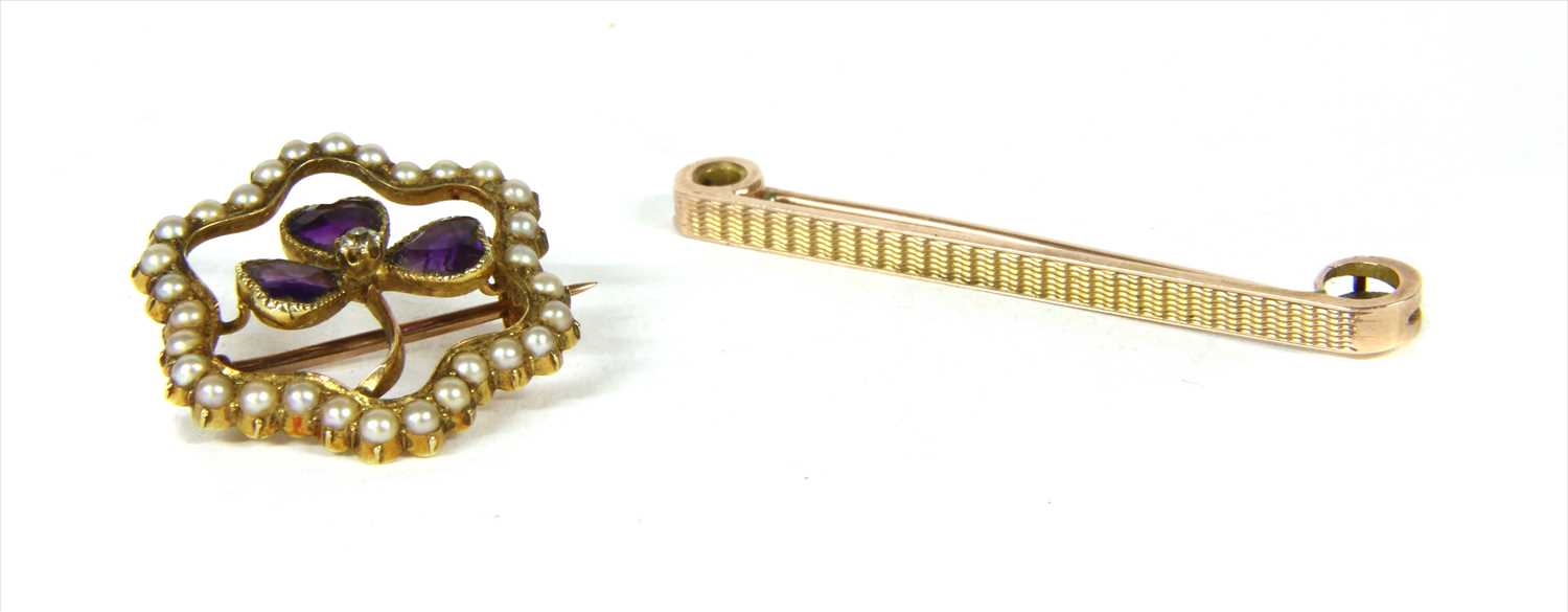 Lot 5 - A Victorian gold diamond, amethyst and split pearl shamrock brooch