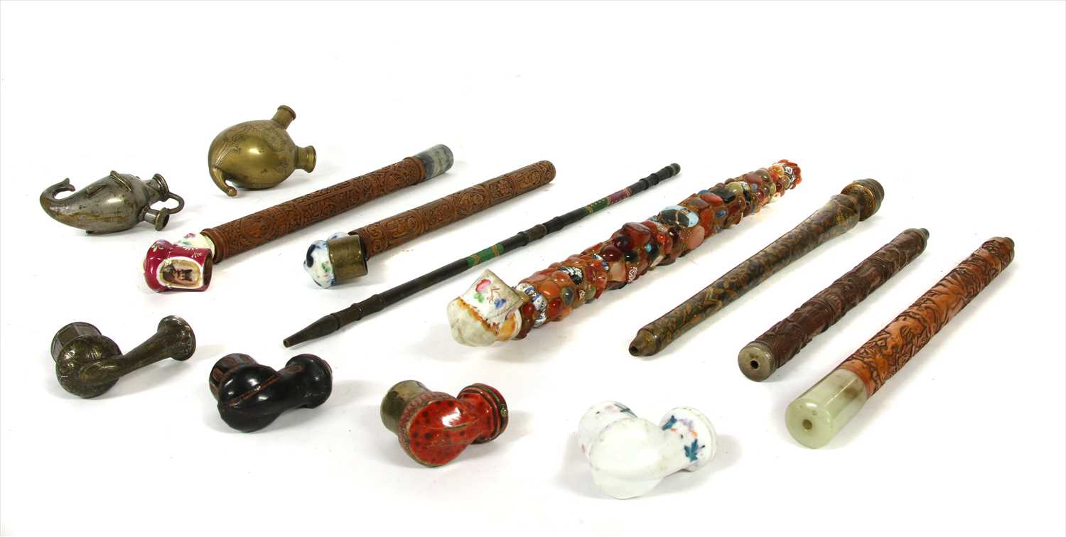 Lot 18 - Four Persian carved wood pipes