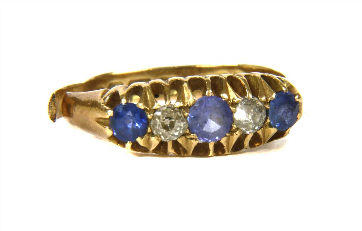 Lot 7 - An 18ct gold five stone sapphire and diamond ring