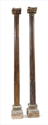 Lot 714 - A pair of padouk or rosewood columns