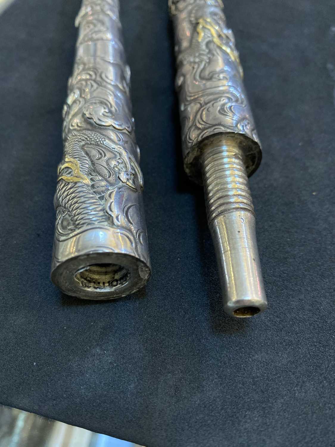 Lot 19 A Japanese silver twopart kiseru pipe,