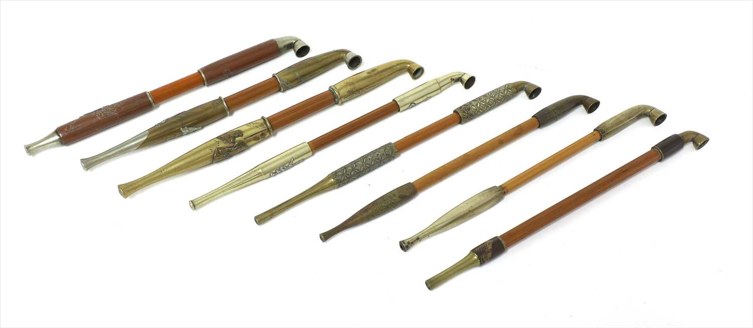 Lot 21 - A collection of eight Japanese kiseru tobacco pipes