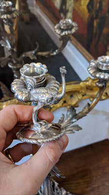 Lot 104 - A silver-plated three-branch candelabrum