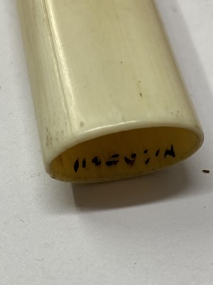 Lot 36 - A Japanese ivory kiseruzutsu with kiseru