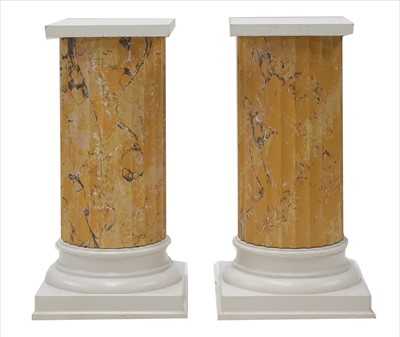 Lot 915 - A pair of fluted faux marble columns