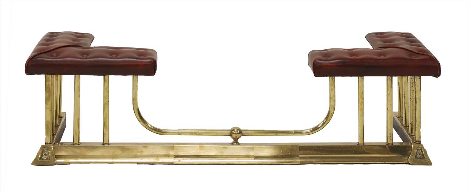 Lot 646 - A brass club fender