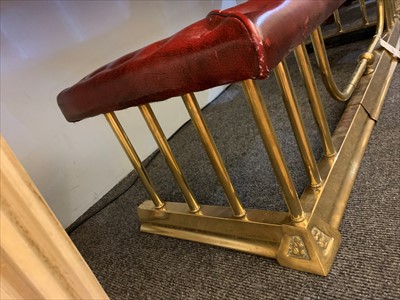 Lot 646 - A brass club fender