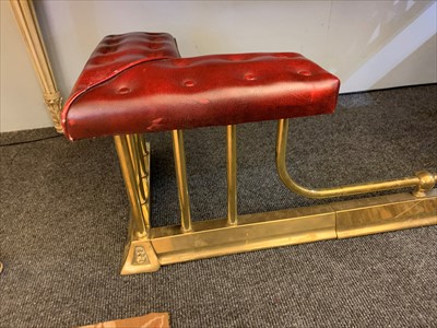 Lot 646 - A brass club fender
