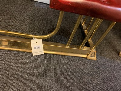 Lot 646 - A brass club fender