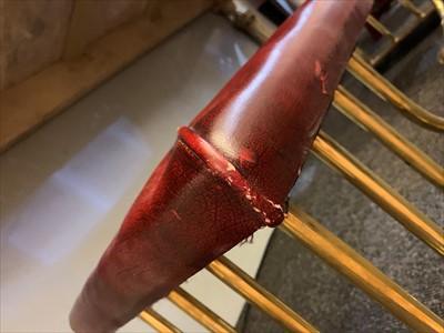 Lot 646 - A brass club fender