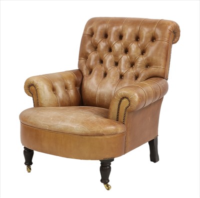 Lot 900 - A brown leather button back chair