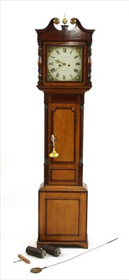 Lot 511 - A late Georgian oak and mahogany crossbanded longcase clock