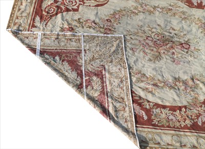 Lot 675 - A large Aubusson needlepoint carpet