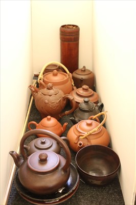 Lot 298 - A collection of Oriental redware teapots