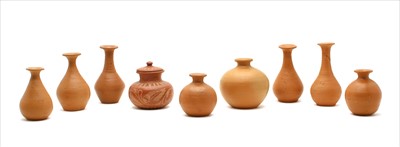 Lot 296 - A collection of terracotta Romanesque vases