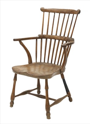 Lot 799 - An ash and elm comb back Windsor chair