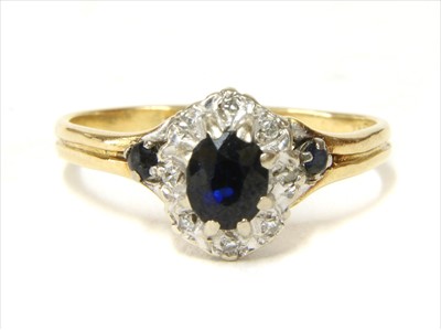 Lot 33 - A gold sapphire and diamond cluster ring
