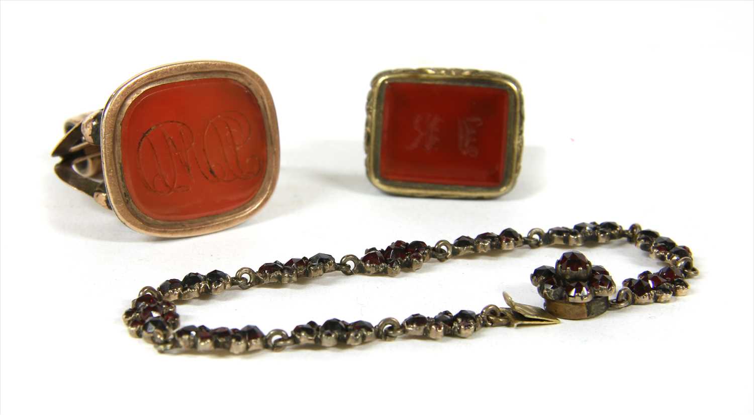 Lot 39 - Two Georgian gold cased seal fobs