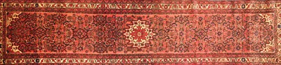 Lot 477A - A red ground wool runner