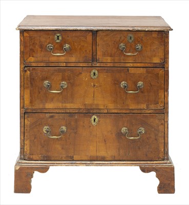 Lot 956 - A small George II-style walnut and pine chest