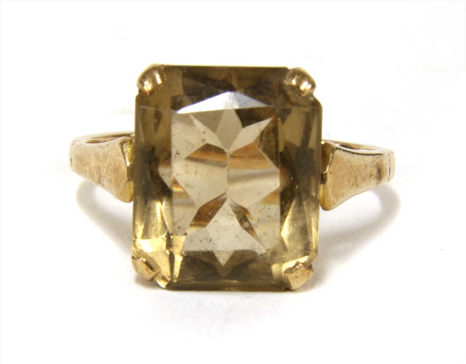 Lot 15 - A gold single stone smoky quartz ring