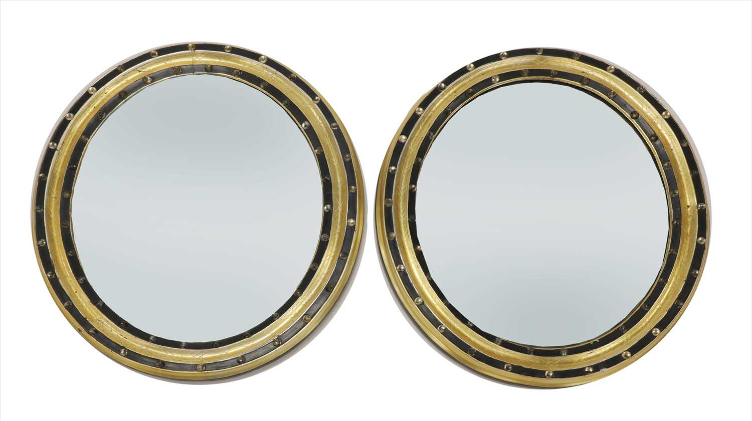 Lot 819 - A pair of oval Irish wall mirrors