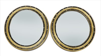 Lot 819 - A pair of oval Irish wall mirrors